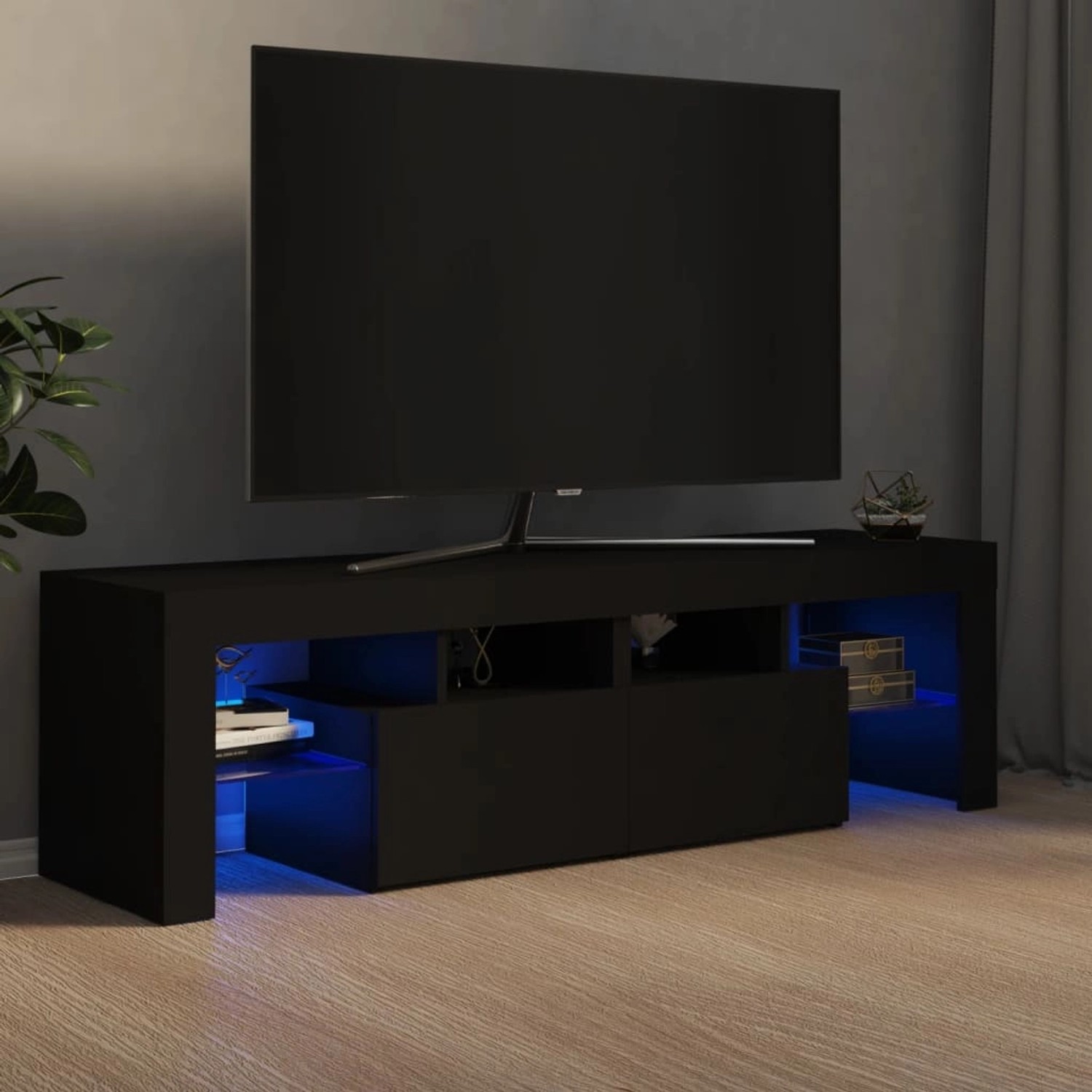 Schwarzer VidaXL TV-Schrank mit LED-Beleuchtung, 140 cm breit, Teil der Wohnwand.