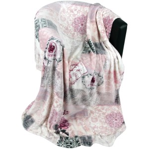 Bestlivings Kuscheldecke 150x200 cm Flanell Mandarino mit floralem Muster auf Sessel.