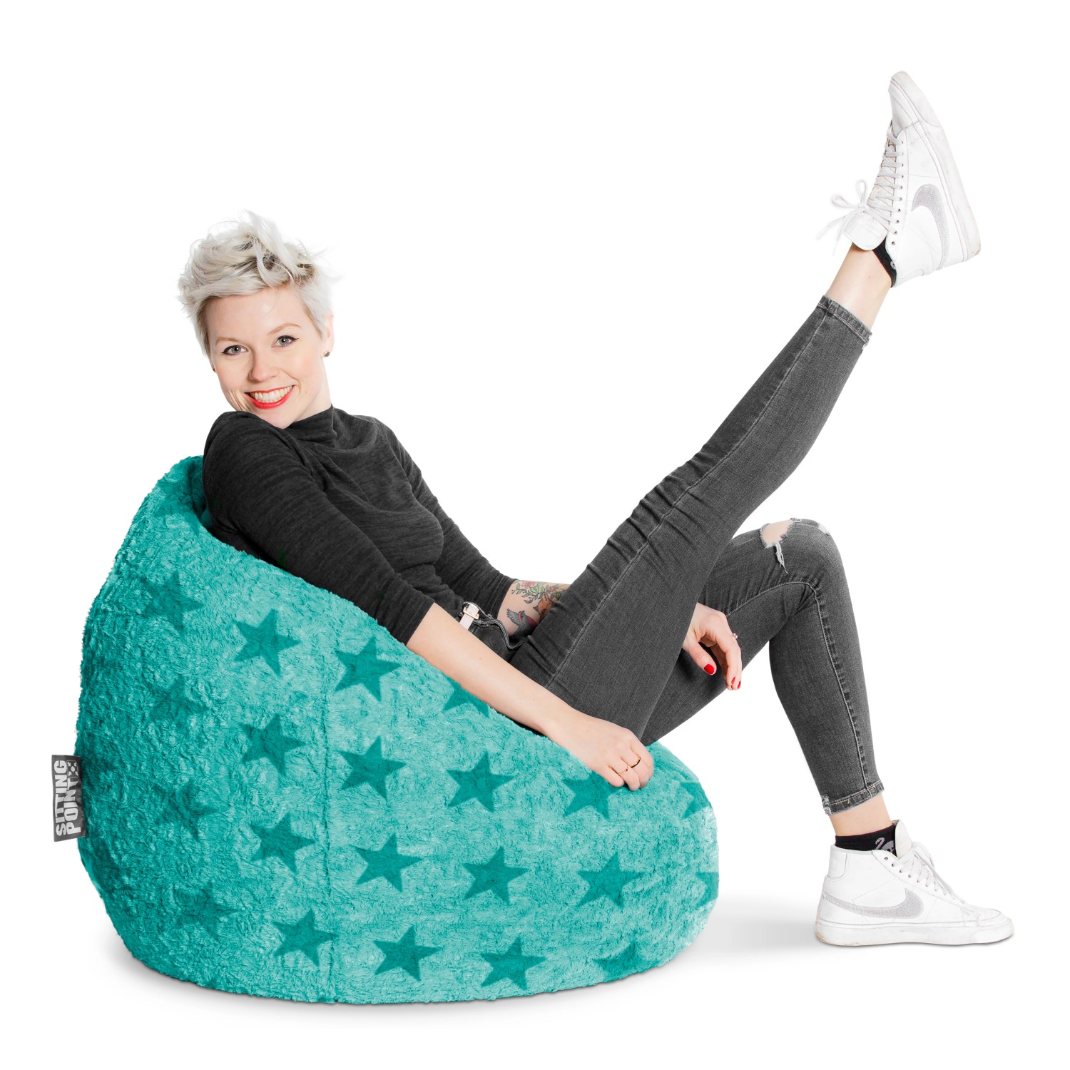 Türkiser Sitzsack BeanBag Fluffy mit Sternenmuster, 220 l, mit entspannter Person.