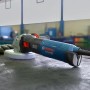 Bosch Professional GWS 17-125 Winkelschleifer, blau/schwarz, auf Werkbank.