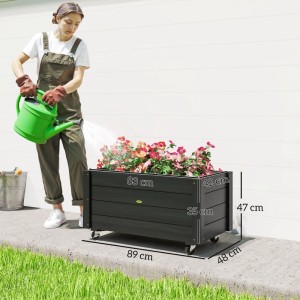 Schwarzes Tannenholz Hochbeet auf Rollen mit bunten Blumen. Ideal für Garten und Terrasse. Maße 89x48x47 cm.