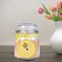 Gelbe Duftkerze im Bonbonglas mit Lama-Motiv und Vanilleduft.