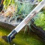 Teichschlammsauger 2.0 Edelstahl im Einsatz: Reinigung von Teich mit Schmutzpartikeln im Saugschlauch.