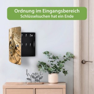 Design Schlüsselkasten aus Edelstahl mit sitzendem Buddha Motiv, offen, an weißer Wand. Bietet Platz für 10 Schlüssel.