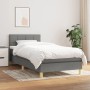 Dunkelgraues Boxspringbett (80x200 cm) mit Matratze und Kopfteil. Stoffbezug, Holzfüße.