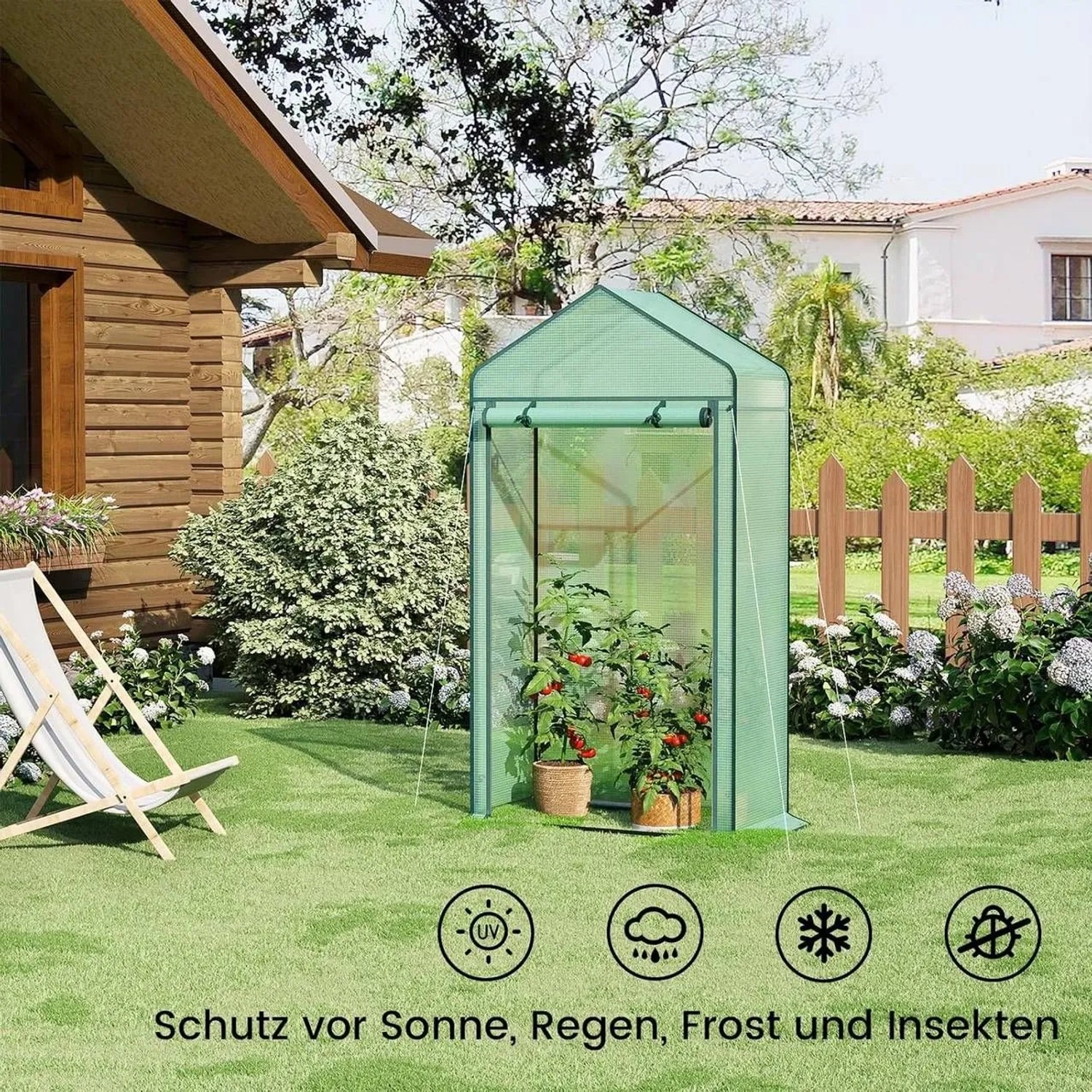 Grünes WOLTU Foliengewächshaus 100x50x190cm im Garten.