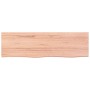 Helle, rechteckige Waschtischplatte aus behandeltem Massivholz (Eiche) mit Naturkante, 100x30x2 cm.