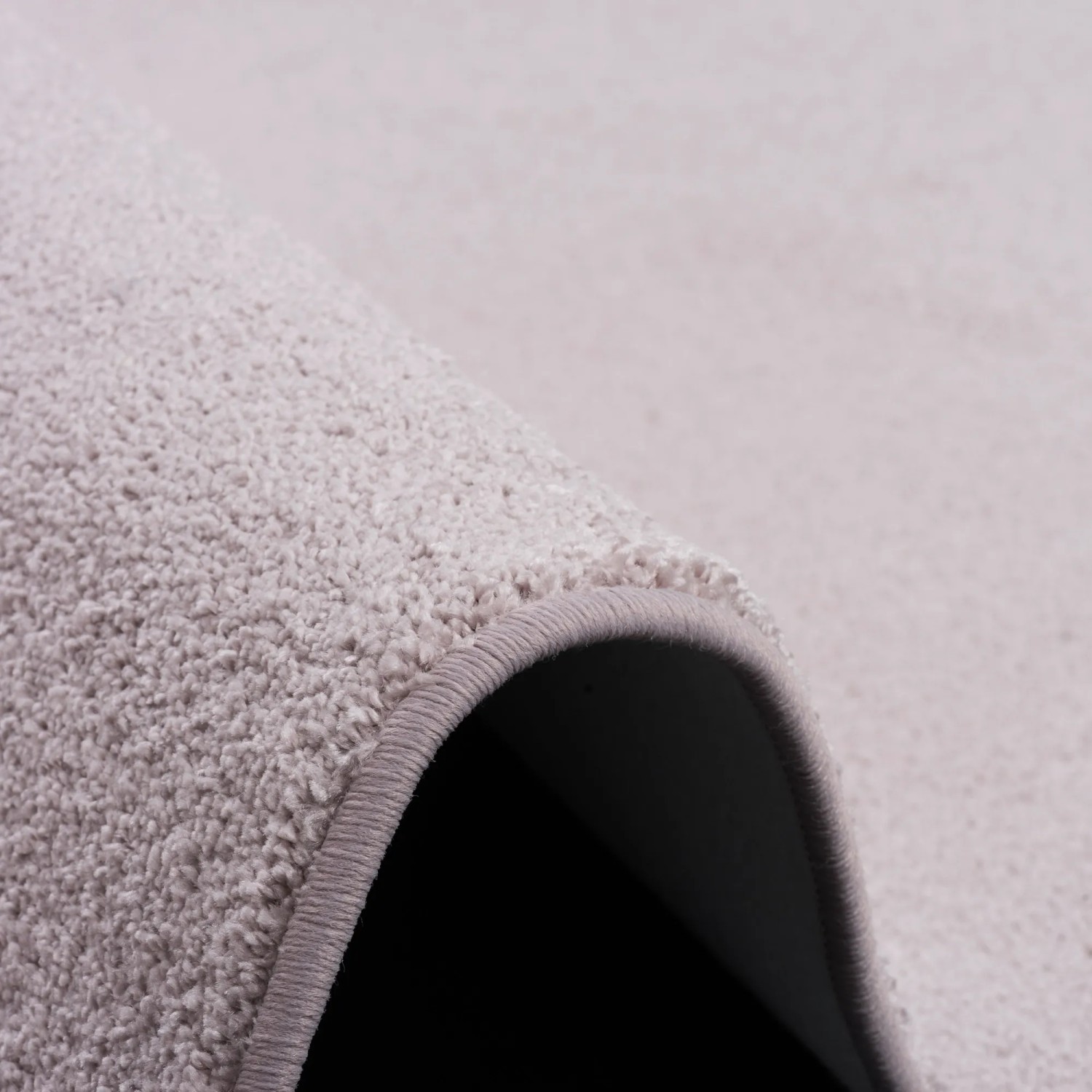 Detailaufnahme: Rosa Snapstyle Teppich Shine (160x200cm) mit weichem Velours-Flor.