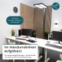 Schwarze LUXULA LED Bürostehleuchte mit Doppelkopf an Schreibtisch im Büro.