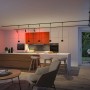 Paulmann URail LED-Schienensystem mit schwarzen RGBW Spots in moderner Küche. Dimmbares, smartes Licht für Wohnbereiche.