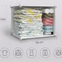 Weißes Rebiko Modul 35x35 cm, gefüllt mit gefalteter Kleidung. Modularer, faltbarer Kleiderschrank für flexible Aufbewahrung.