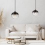 Zwei moderne, schwarze Just Light Pendelleuchten Zea mit Rauchglas über einem Wohnzimmer.