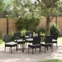 Schwarze 7-teilige vidaXL Garten Essgruppe aus Poly Rattan mit Tisch und Stühlen im Garten.