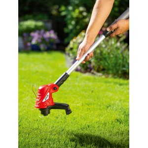 Roter CMI Elektro-Rasentrimmer C-ERT-350/25 im Einsatz auf Rasenfläche.