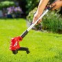 Roter CMI Elektro-Rasentrimmer C-ERT-350/25 im Einsatz auf Rasenfläche.