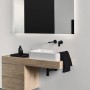 Ideal Standard Designsiphon G 1 1/4, schwarz matt, unter einem Waschbecken im modernen Bad.