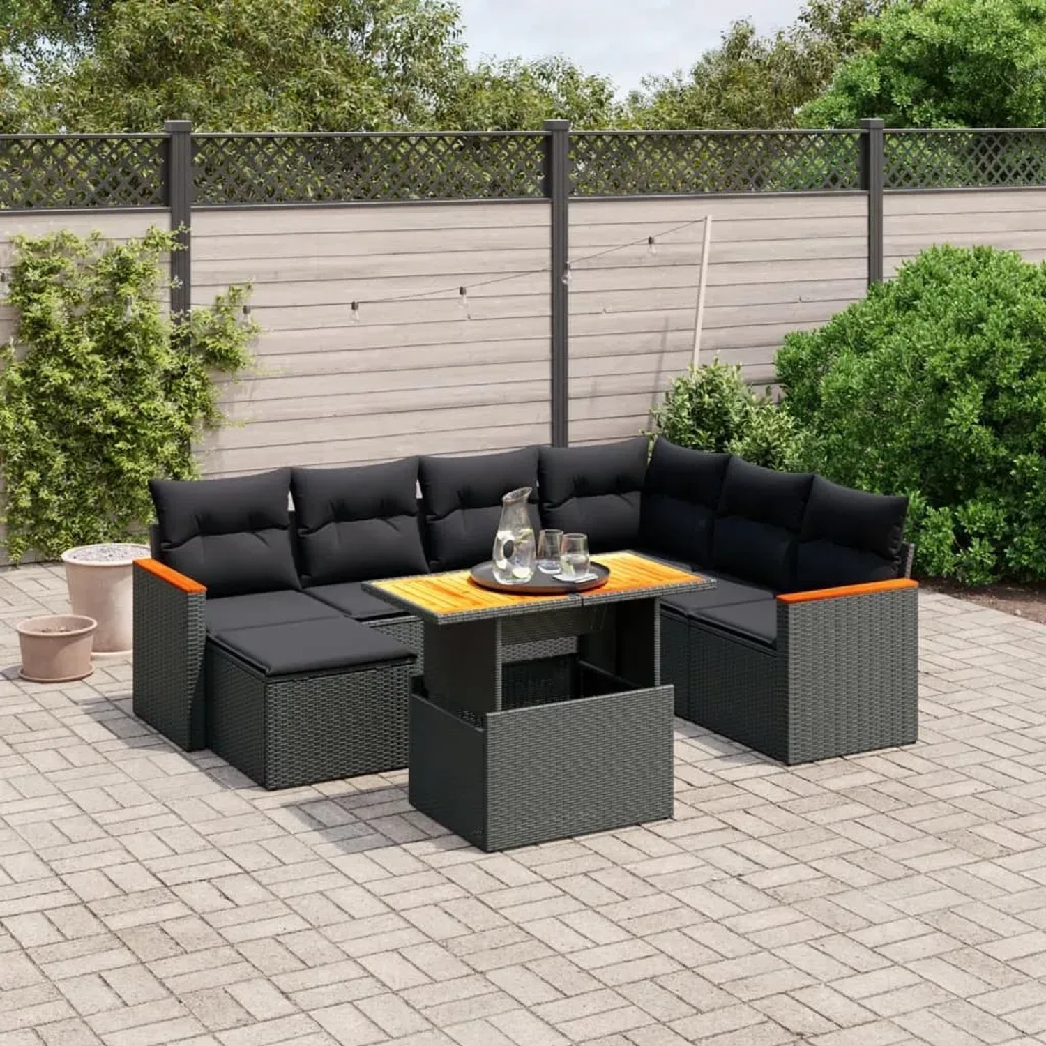 Schwarze 8-tlg. vidaXL Garten-Sofagarnitur aus Poly Rattan mit Kissen und Tisch.
