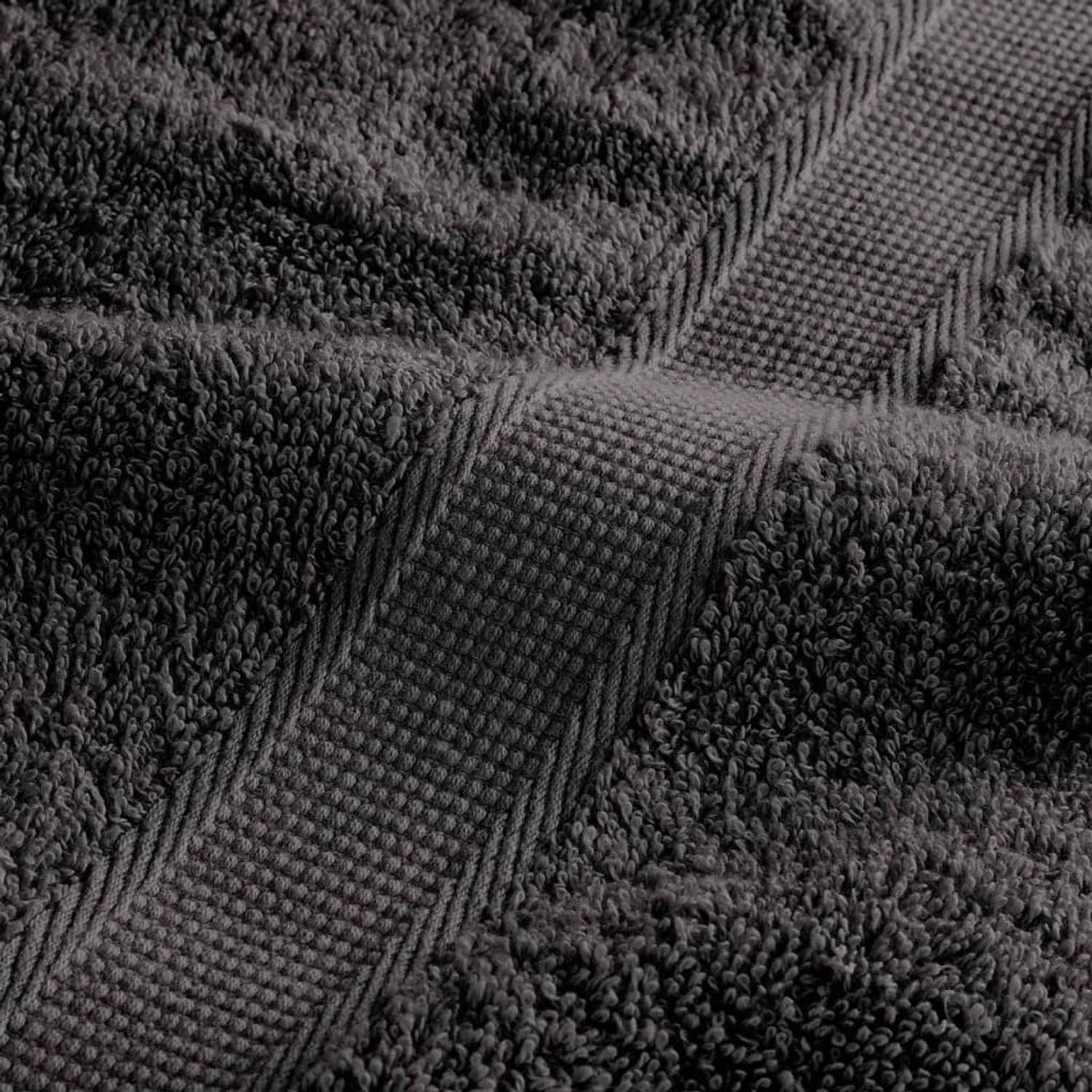 Nahaufnahme eines anthrazitfarbenen Premium-Handtuchs aus Baumwolle (600 g/m²).