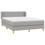 Hellgraues vidaXL Boxspringbett 140x190 cm mit Matratze und Kopfteil.