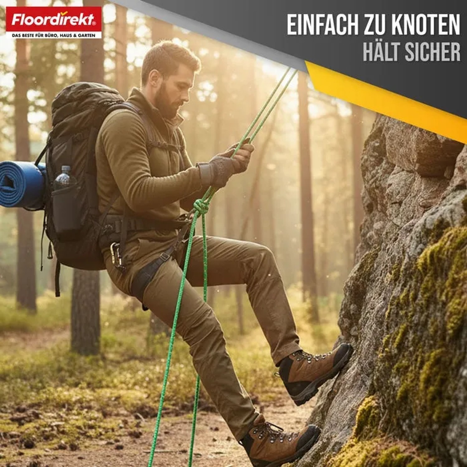 Mann seilt sich mit grün-rotem Polypropylen Seil K2 von Floordirekt ab.