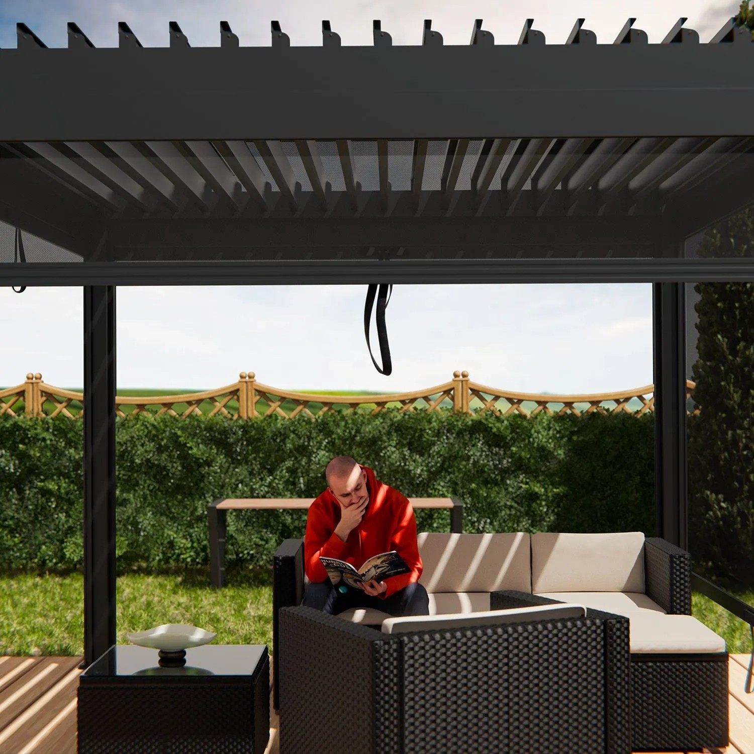 Juskys Pergola Lamellendach Tahiti 3x3 m, anthrazit, mit sitzender Person im Garten.