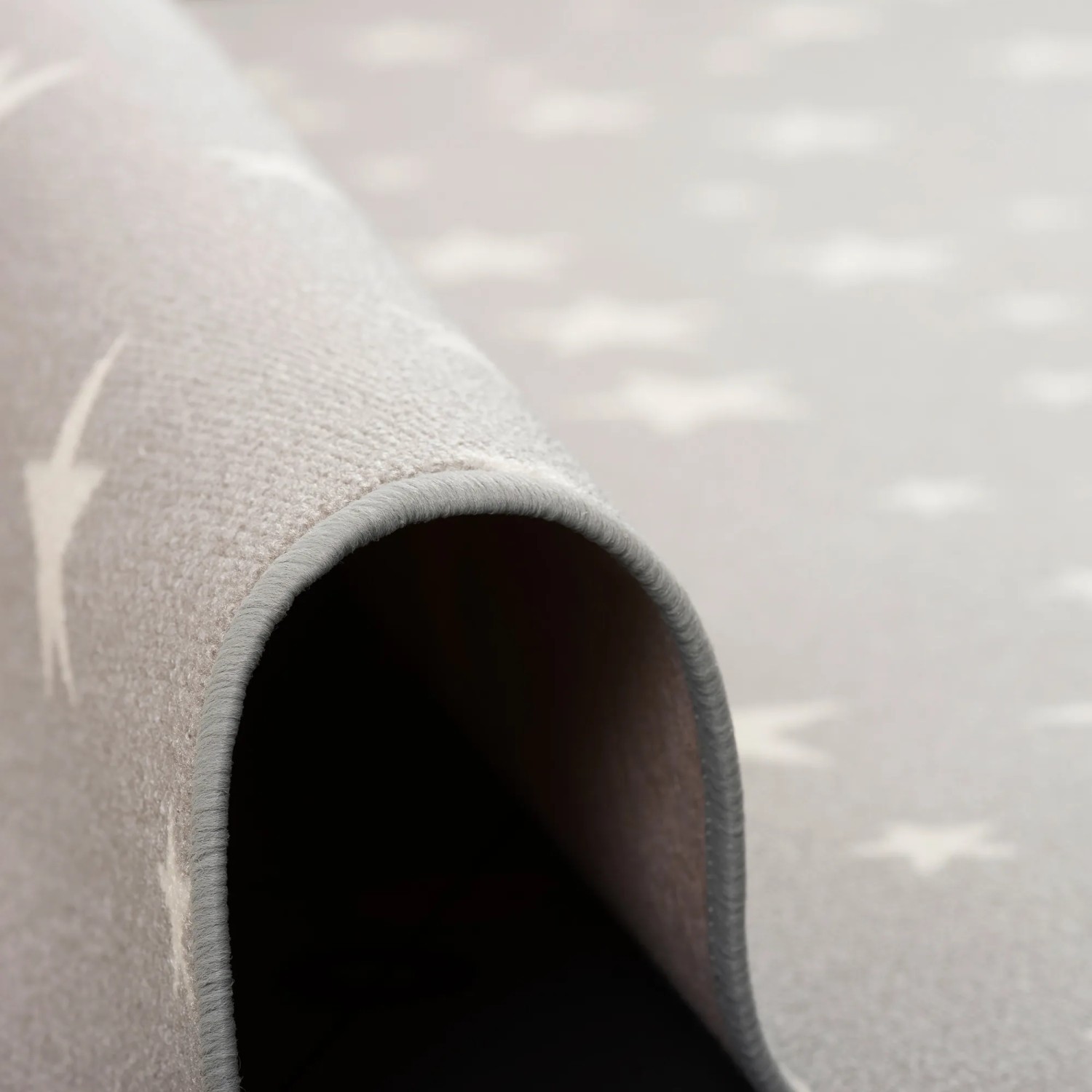 Grauer Kinderteppich mit Sternenmuster, Snapstyle, 80x320 cm.
