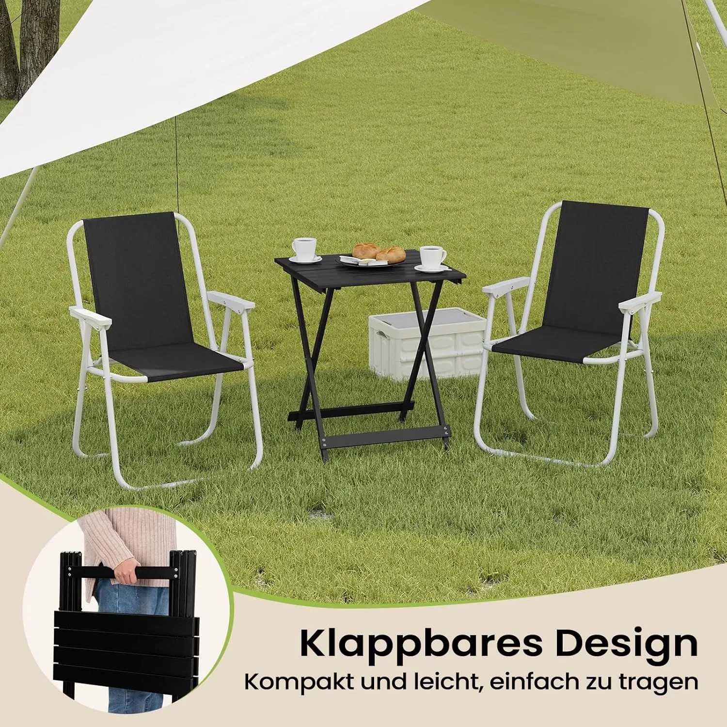 Schwarzer WOLTU Klapptisch aus Aluminium mit zwei Campingstühlen auf Rasen.