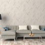 A.S. Création Vliestapete in Beige-Gold mit Marmoroptik im Wohnraum.