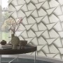 Erismann Vliestapete Spotlight Pose Anthrazit mit 3D-Flecht-Design an einer Wand.