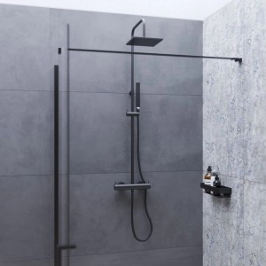 Großformatige graublaue Keramikfliesen in Zementoptik an der Wand einer modernen Dusche. Ideal für Bad & Küche.