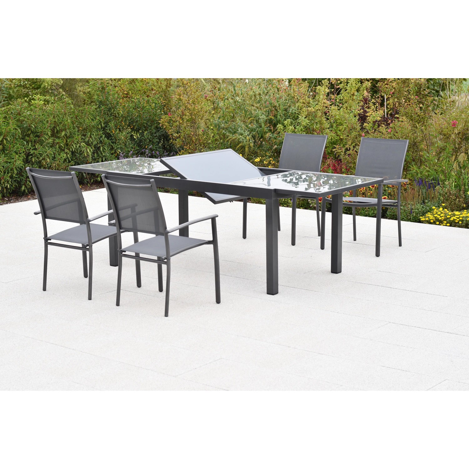 Merxx Milano Gartenmöbel-Set mit Ausziehtisch und 4 Stapelsesseln, graphitfarbenes Gestell, graue Textilbespannung.