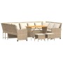 Beige 4-teilige Garten-Sofagarnitur aus Polyrattan mit Tisch und Kissen.