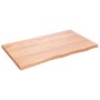 Helle, rechteckige vidaXL Waschtischplatte aus behandeltem Massivholz (Eiche) mit Naturkante.
