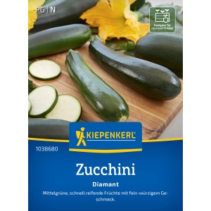 Kiepenkerl Zucchini Diamant F1-Hybride: Dunkelgrüne Zucchini und Zucchinischeiben auf Holzbrett.