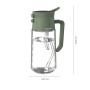 Grüne Fiskars Gießkanne aus Glas mit Sprühfunktion, 0,5 l. Ideal für Zimmerpflanzen und Bewässerung.