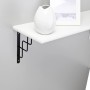 Schwarze OBI Konsole Roxy (230x180mm) mit weißem Regalbrett an grauer Wand.