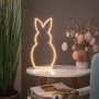 Paulmann FlexLED 3D Basis-Set als leuchtender Hase, warmweiß, auf Tisch mit Osterdeko.