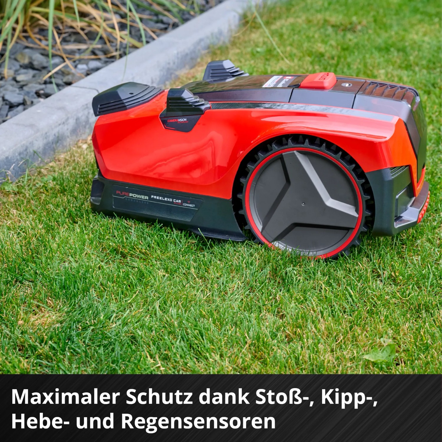 Einhell Freelexo Cam Plus 600 Mähroboter in Rot/Schwarz auf Rasen, Nahaufnahme.
