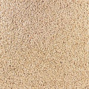 Helle, gerundete Marmorsteine in Crema-Farbe, 4-6 mm Körnung, als Terralith Steinteppich für Außenbereiche.