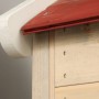Detailaufnahme: Wendi Toys Kinderspielhaus Krokodil mit rotem Dach und weißen Zierelementen.