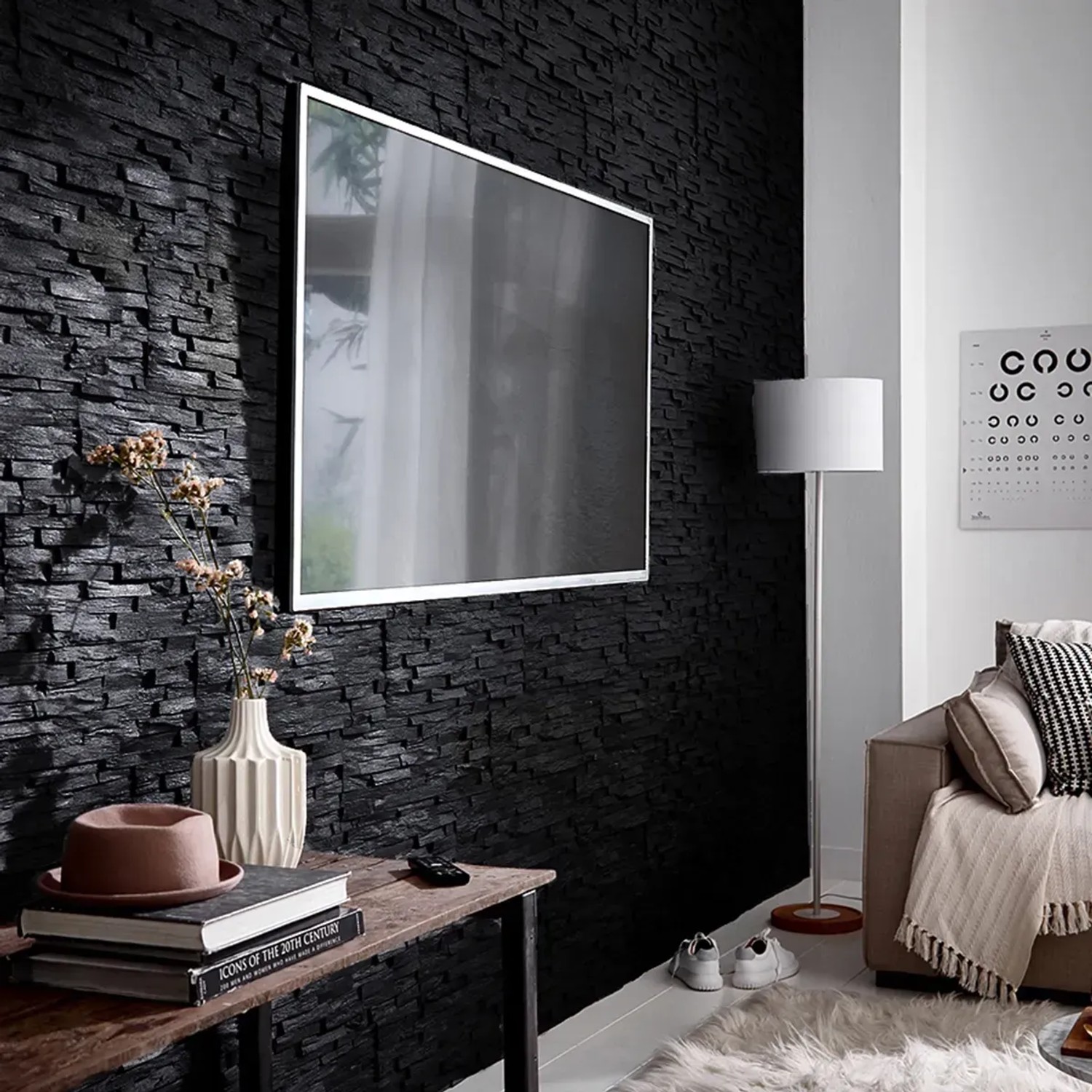 Wohnraum mit schwarzem Rebel of Styles Verblender Porto Black EPS in Steinoptik.