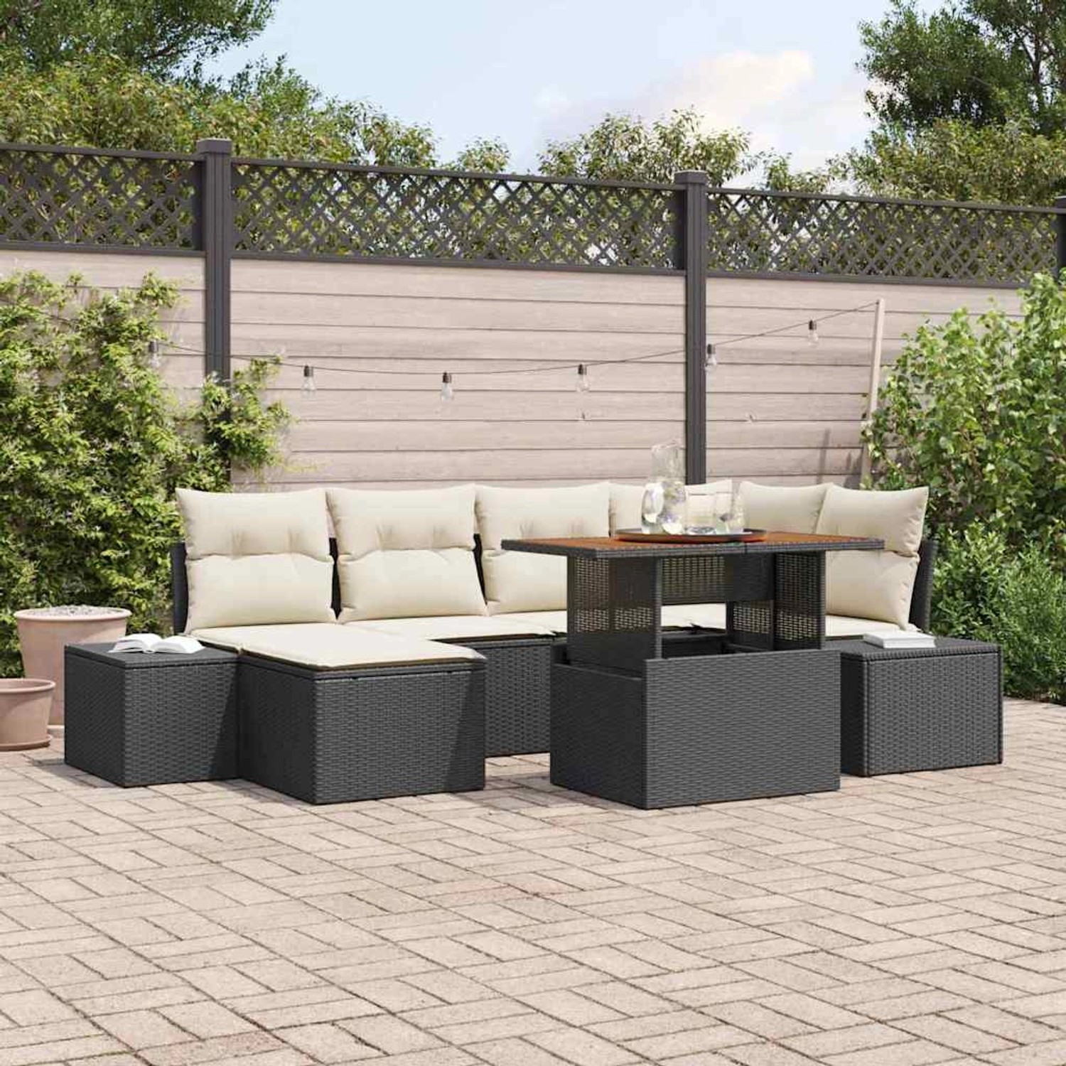 Schwarzes 7-teiliges Garten-Sofa-Set aus Rattan mit Tisch und Stauraum.
