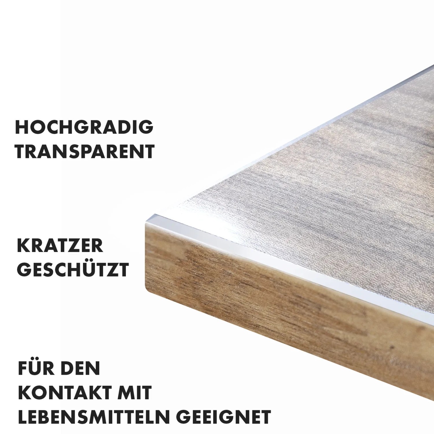 Detailansicht der transparenten, mattierten KARAT Tischfolie Imperial mit abgeschrägter Kante auf Holztisch.