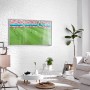 Wohnzimmer mit weißer Wand aus Rebel of Styles Verblender Porto EPS, darauf ein Fernseher.