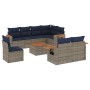 Graue 9-teilige Garten-Sofagarnitur aus Polyrattan mit marineblauen Kissen und Akazientisch.