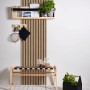 AS-Creation 3D-Panel Pop up Tapete in Beige-Braun mit Holzpaneel-Optik an einer Wand.