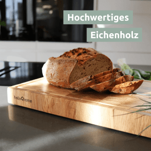 Holz4home Premium Schneidebrett aus Eiche (L) mit Brot und Brotscheiben.