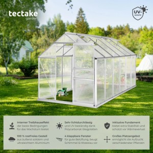 Transparentes Tectake Gewächshaus mit Alu-Rahmen und Fundament im Garten.