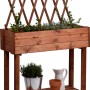 Rollbares Hochbeet aus Holz mit Rankhilfe, braun, 130x79x28,5cm. Mit Ablagefläche und Kräutern bepflanzt.