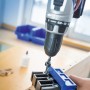 LUX Dübellehre Classic aus Kunststoff im Einsatz mit Bohrmaschine für präzise Dübelverbindungen.